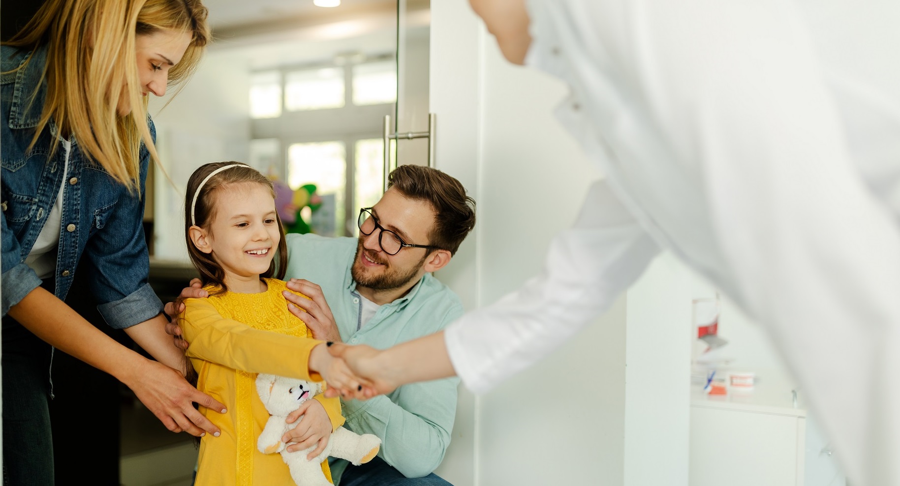 Parents and girl in meeting with doctor orthodontist, dental examination and dentist consultation.